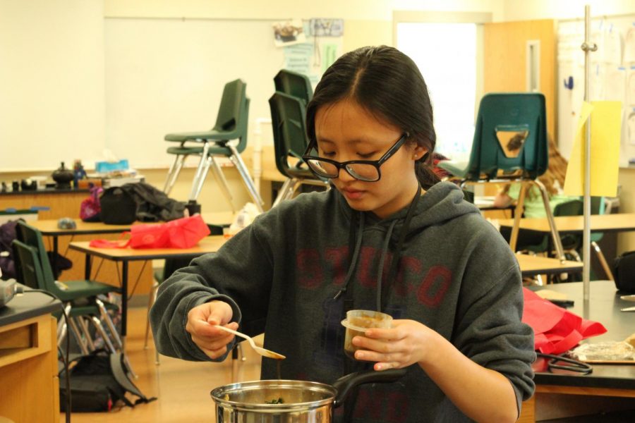 Gia Tong of Asian Caucus  preparing her ramen for the judges. 