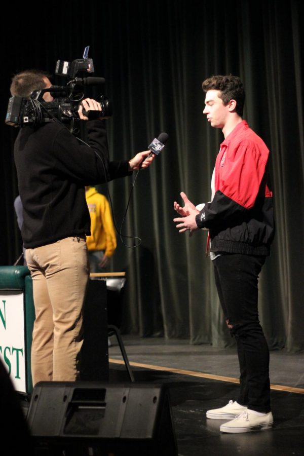 Senior Caden McCormack is interviewed on Feb. 6, after signing with 4 fellow students. 