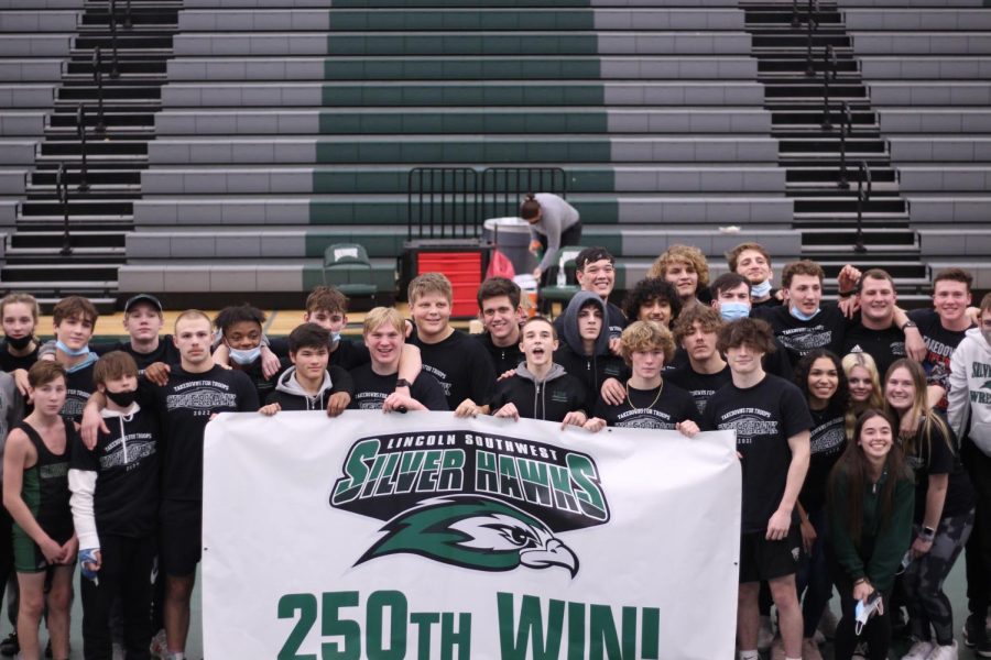 All of the wrestling team celebrate the 250th win after takedown for the troops. 