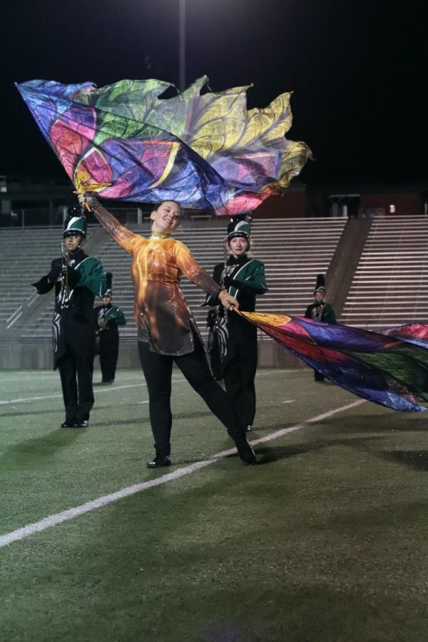 Eden Wilder performing the Color Guard routine at a home football game.
Photo by Emma DeShon 