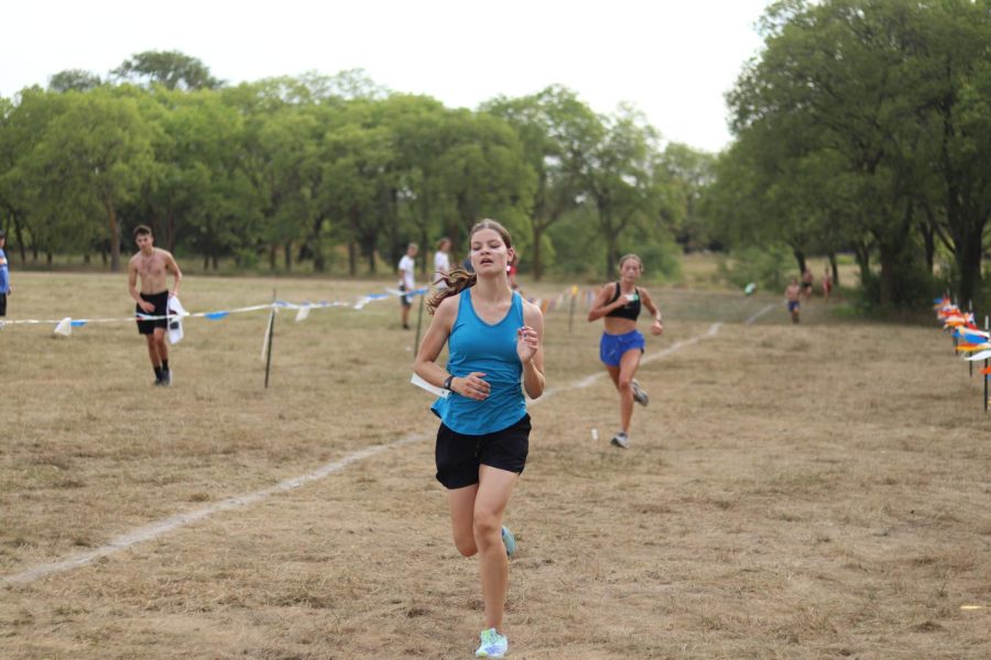 Sophomore Megan Baugh runs at the time trial on Aug. 27 at Pioneers Park. The first meet of the season will be on Sept. 3. 