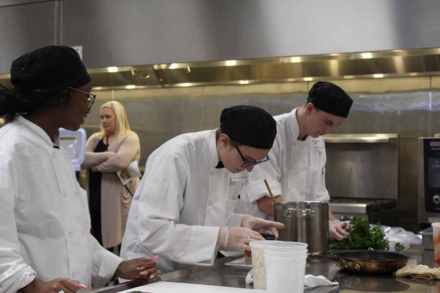 Senior Wren Poessnecker plates food for the LPS cooking competition at The Career Academy on Dec. 7, 2022. The Southwest culinary teams will next compete at State on Feb. 8 in Hastings. 