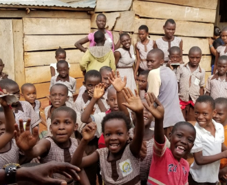 Children in Uganda enjoying their free time before school.