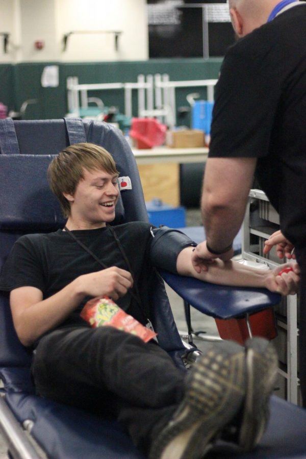 Senior Bryce Offutt gives blood at the blood drive in September. The next blood drive will be held on Thursday, Feb. 7 at 8:30 a.m. to 3:00 p.m.