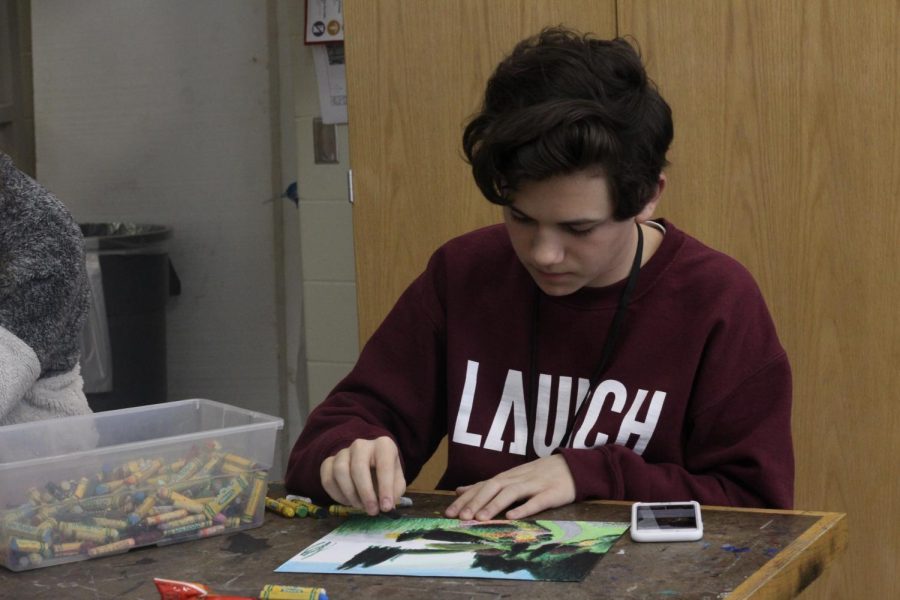 Freshman August Hudson working in Art Club. Art club meets every Thursday at 3:15 in room C106.