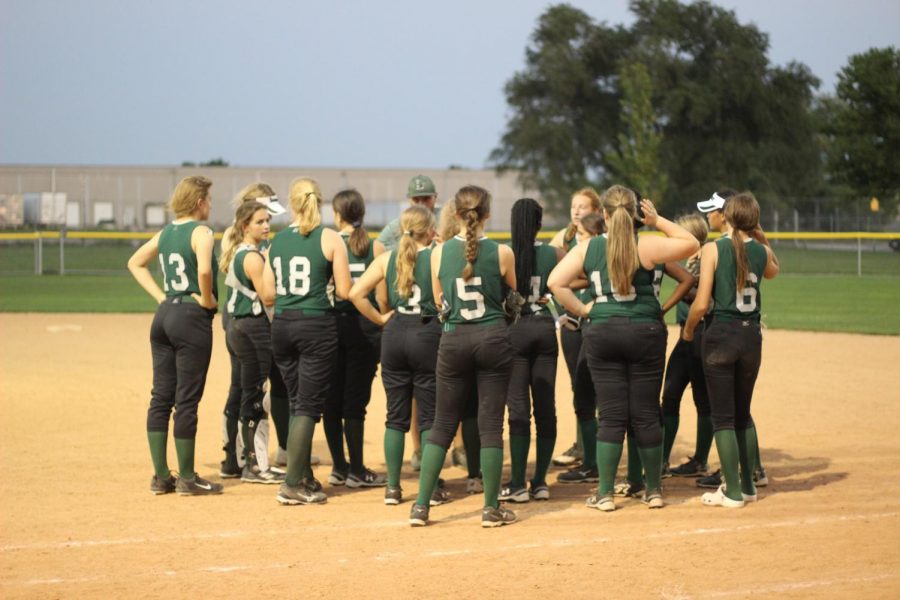 LSW reserve softball team huddle up during their game against Northstar High School. They play again on Sept. 17 against Northeast at 6:30 p.m.