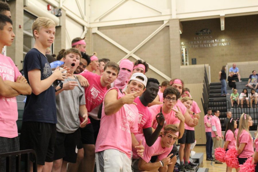  People dressed up for the pink-out varsity volleyball game.