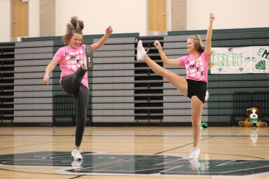 Sophomores Fletcher Petersen and Sage Linder do a high kick while competing in dancing with the emeralds.

