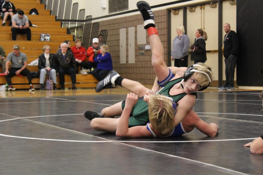 Freshman+Carson+Tridle+pins+his+opponent+during+the+freshman+wrestling+invitational.+This+meet+was+just+for+freshman+on+the+JV+team.