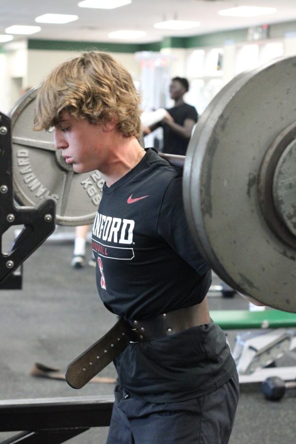 Student does a back squat in weight training on Sept. 19, 2022. An advanced version of the course is available to all students who have previously taken weight training. 