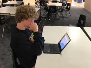 Junior Isaak Hogeland studies for his AP US History Exam. A good score on the test will get him college credit for the class. 