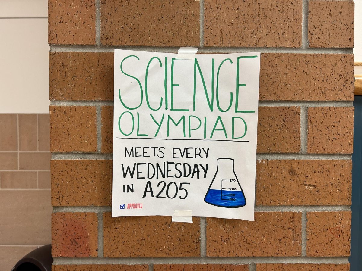Flyers are posted around the school advertising Science Olympiads first team meeting. The meeting will take place this Wednesday, Aug. 30. 