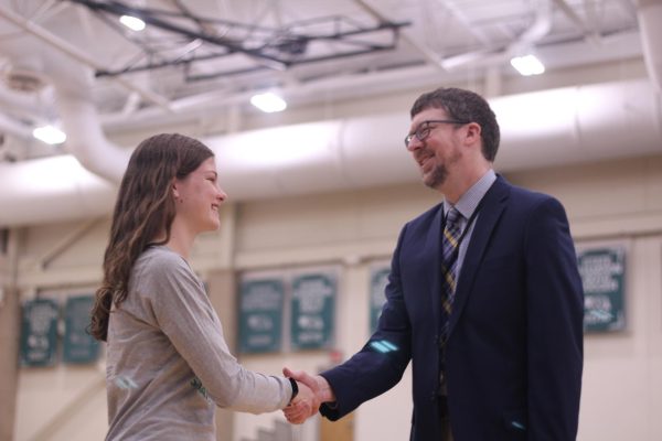 Current junior, Megan Baugh shakes hands with Mr. Matzen at the spring Honors Convocation of the 2022-23 school year. On Wednesday, Sept. 20 Southwest held their first Honors convocation of the 2023-24 school year. 