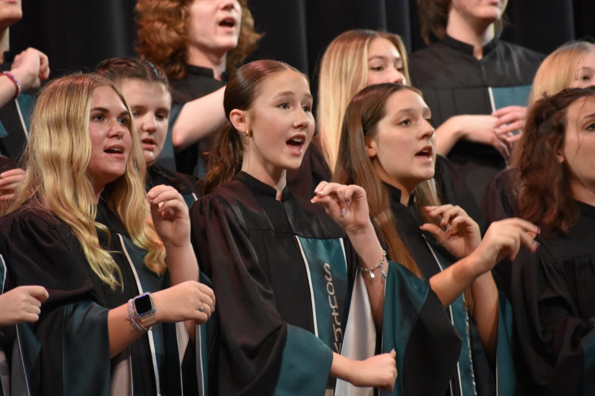 Mixed concert choir sings and dances at the choir concert on Tuesday, Oct. 10. Freshman concert choir, mixed concert choir, varsity concert choir, Hawktet, Quicksilvers and Silverlining all performed. 