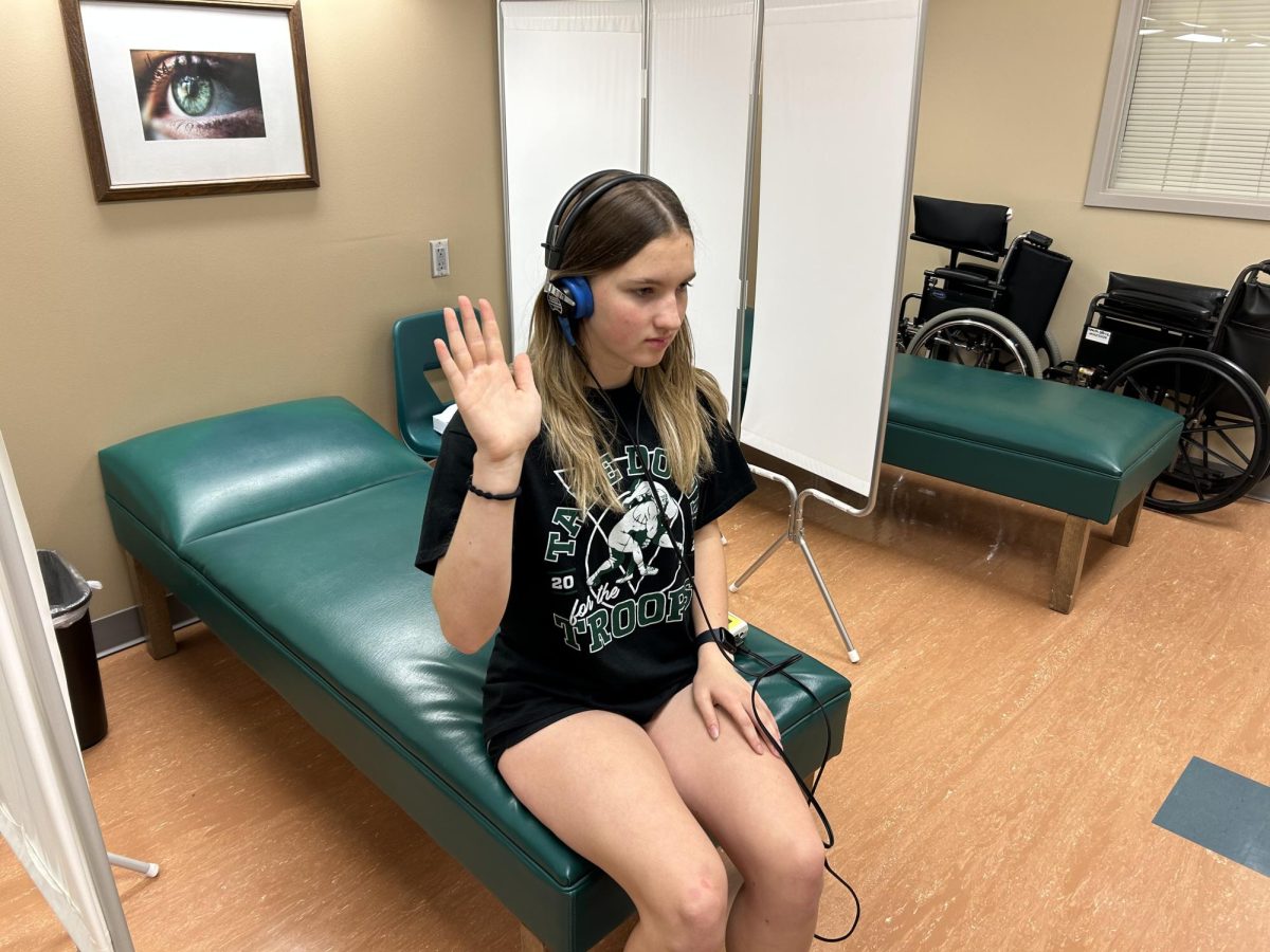 Sophomore Genevieve Baxa participates in the hearing portion of the sophomore health screening. The screening will take place on Wednesday Oct. 11. 