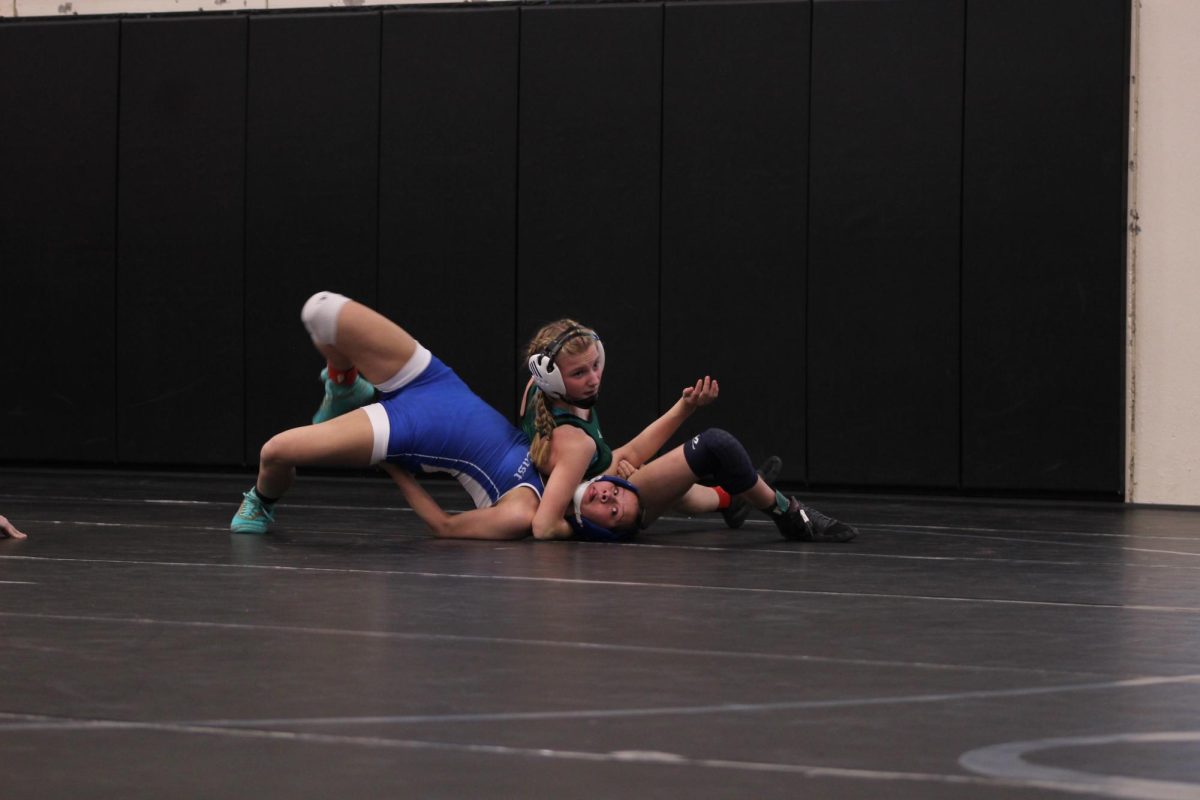 Taylor Siefken wrestles an opponent at their district meet for the 2022-23 school year. She and the girls wrestling team will have their first meet of the 2023-24 school year on Thursday, Nov. 30. 