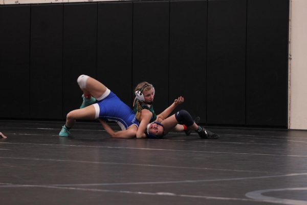 Taylor Siefken wrestles an opponent at their district meet for the 2022-23 school year. She and the girls wrestling team will have their first meet of the 2023-24 school year on Thursday, Nov. 30. 