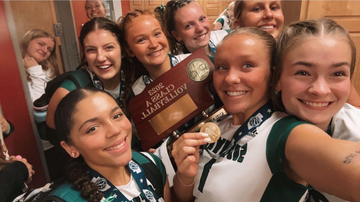 Varsity+girls+volleyball+holding+the+Class+A+state+trophy.+The+girls+beat+Papillion-LaVista+in+a+best+out+of+five+set+match.