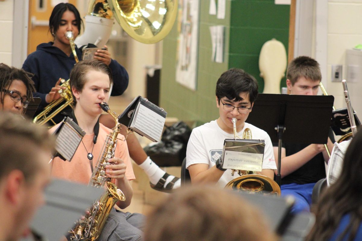 Students practice in the band room before school. The band, choir, and orchestra will perform in a concert at 6:30 p.m. on Monday, Dec. 11.