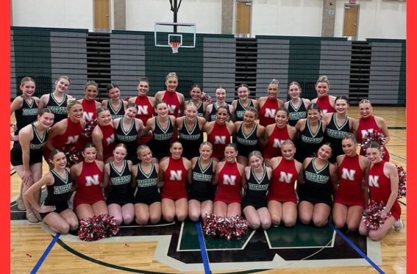The Emeralds pose with the Husker Scarlets after their rehearsal on Saturday, Jan. 6. The Scarlets watched the Emeralds national routine and gave feedback about their performance. 
