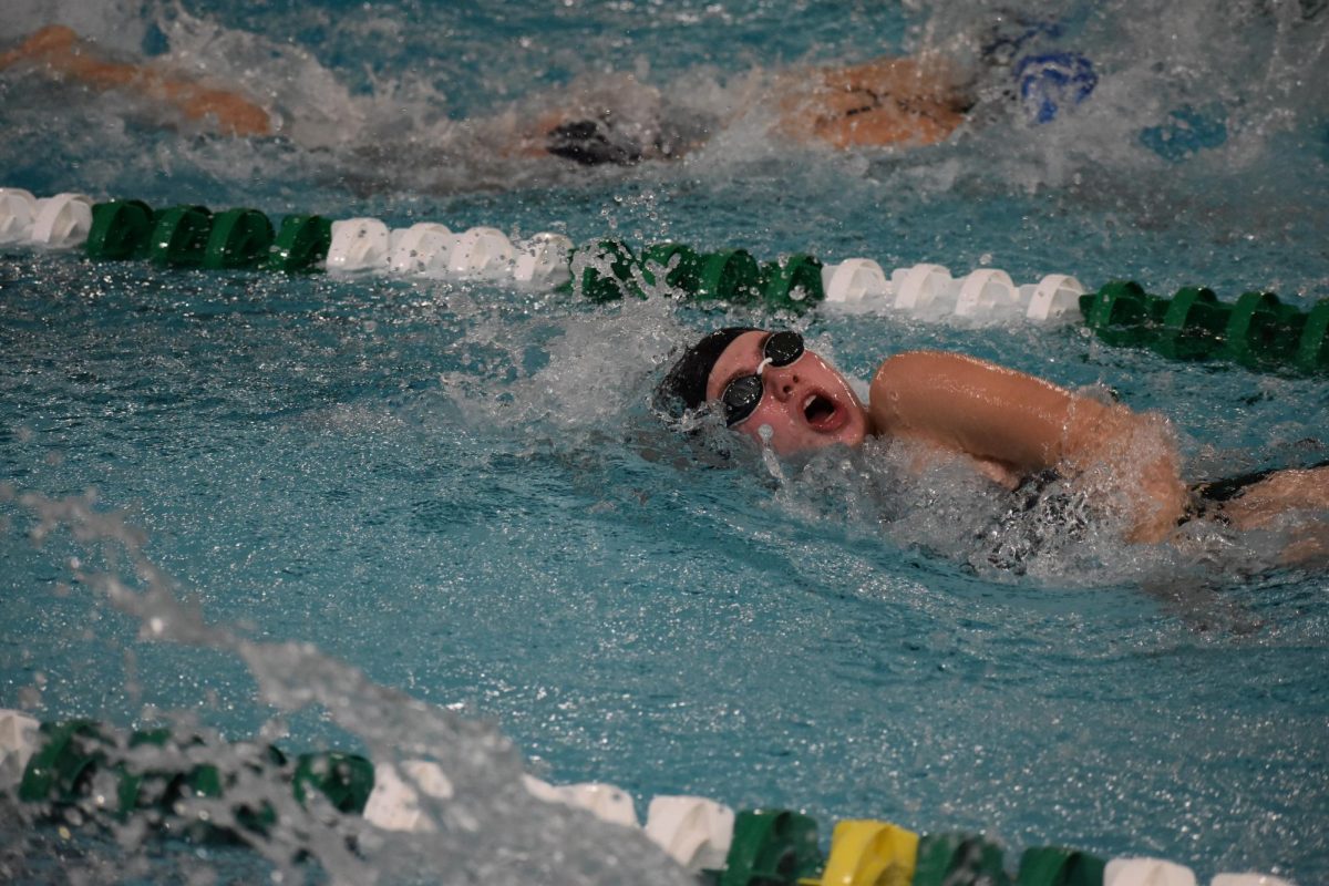 Southwest swimmer swimming at a home meet. On Friday, Feb. 23, LSW swim participated in competition and LSW girls placed tenth and the boys placed third.