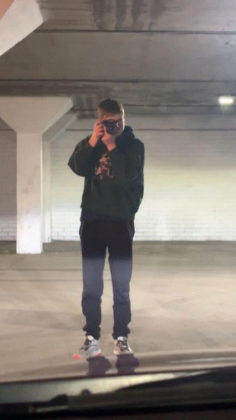 Sophomore Brayden Denton taking photos at an underground garage in downtown Lincoln. 