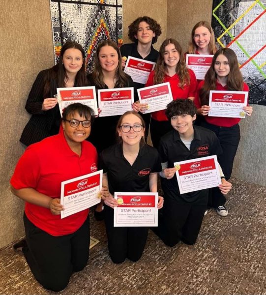 FCCLA State Participants.
All nine participants competed at State. There are posing for their photo while holding up their certificates.