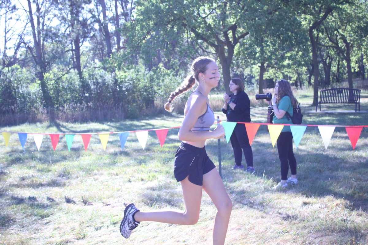 Student runs toward the finish line in the Lincoln Southwest Time Trials. 