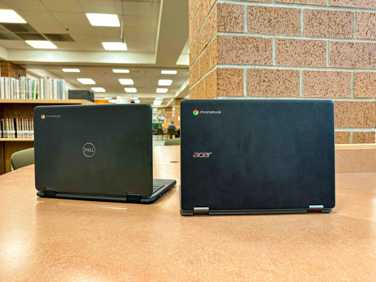 An Acer Chromebook (right) opened in front of a Dell Chromebook (left).  Freshmen switched from a Dell Chromebook to an Acer Chromebook due to a refresh by LPS' C.L.A.S.S. technology plan.