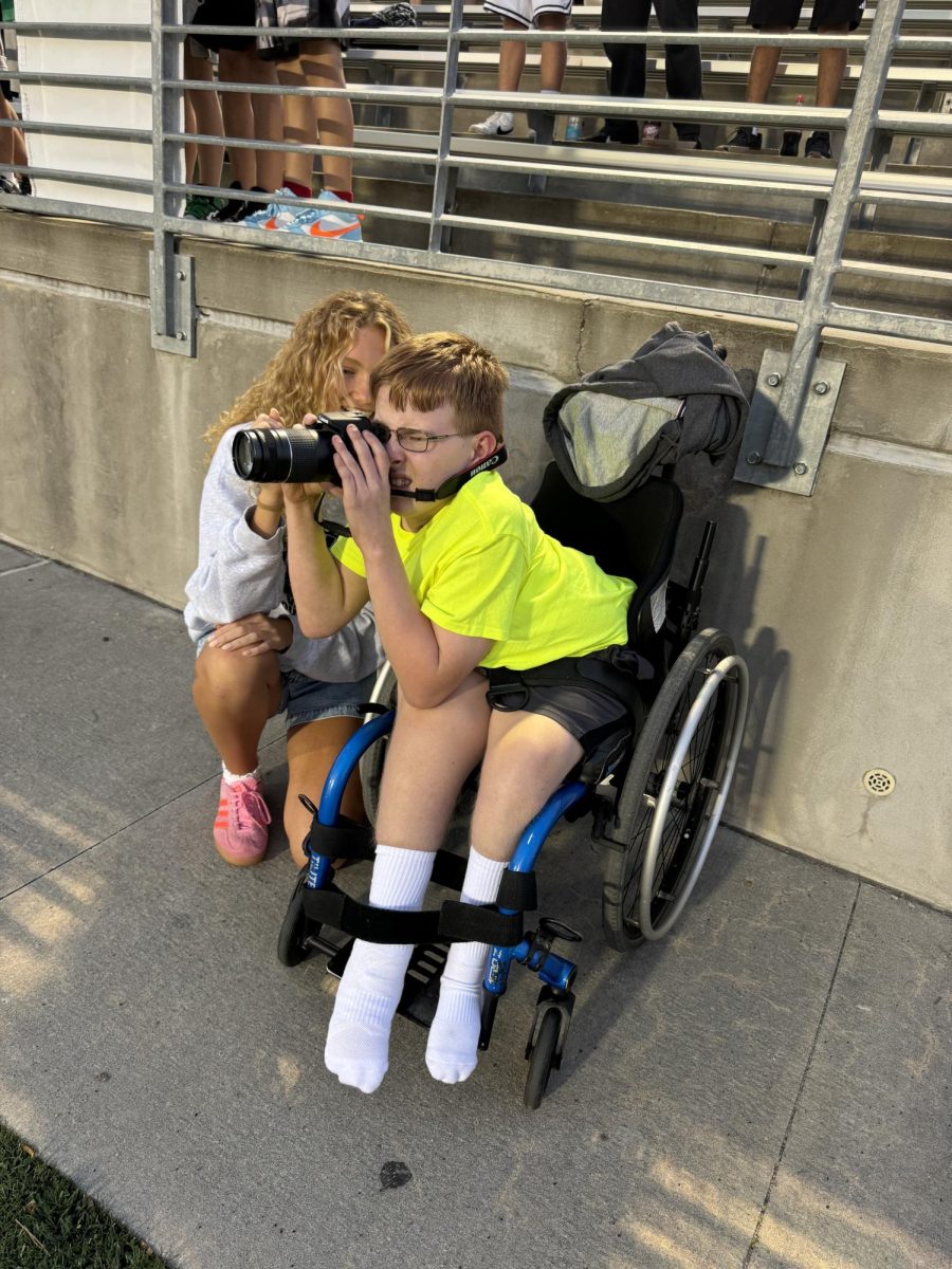 Dathin and Piper taking pictures at the football game on Friday, Aug 30. This was the day Dathin became the first unified photographer in all of Lincoln Public Schools.