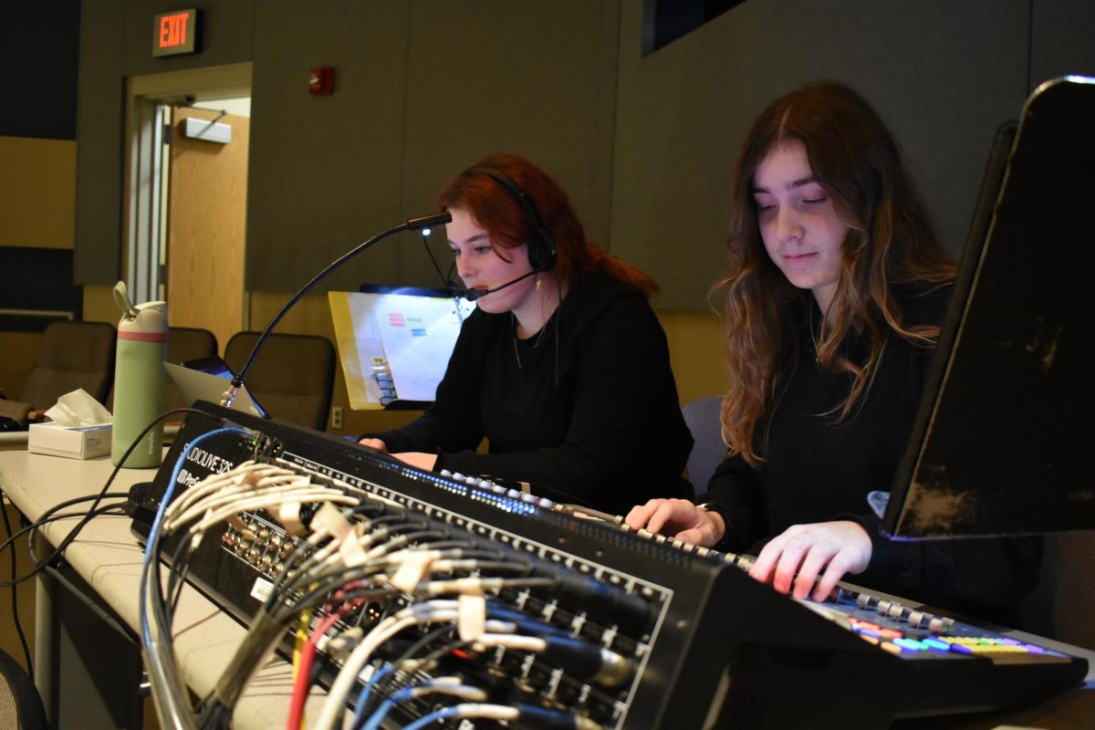 Seniors Charlie Rader and Elizabeth Falcone work the sound board during Peter and the Starcatcher (2023). The backstage tech crew makes up a large part of Silver Hawk Theatre's productions.