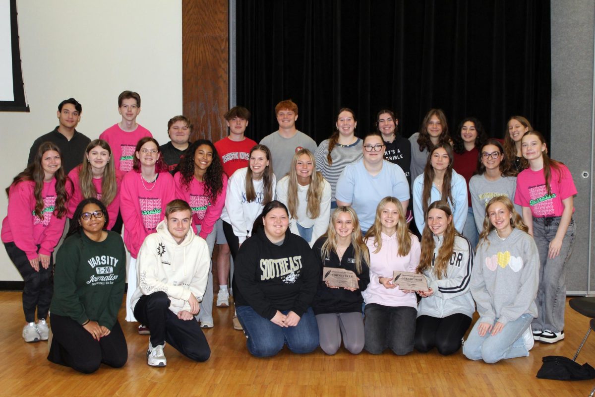 The Lincoln Southwest and Lincoln Southeast Journalism staff posing for a photo after they won their Cornhusker Awards. This presentation was at the National High School Press Association (NHSPA) Fall convention at the University of Nebraska-Lincoln.