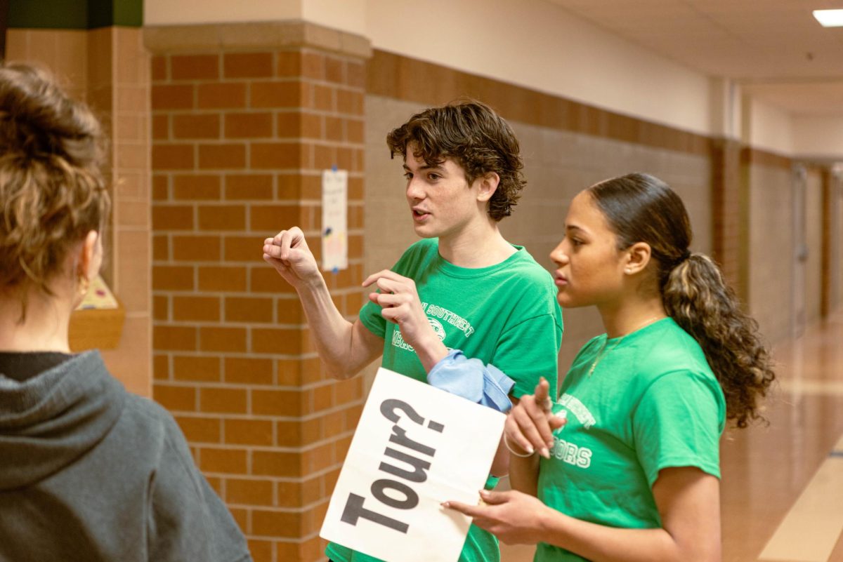 Southwest students at future hawk night offering a tour of the school to current eighth graders. Future Hawk Night allows current 8th graders to see the different opportunities that the school offers.