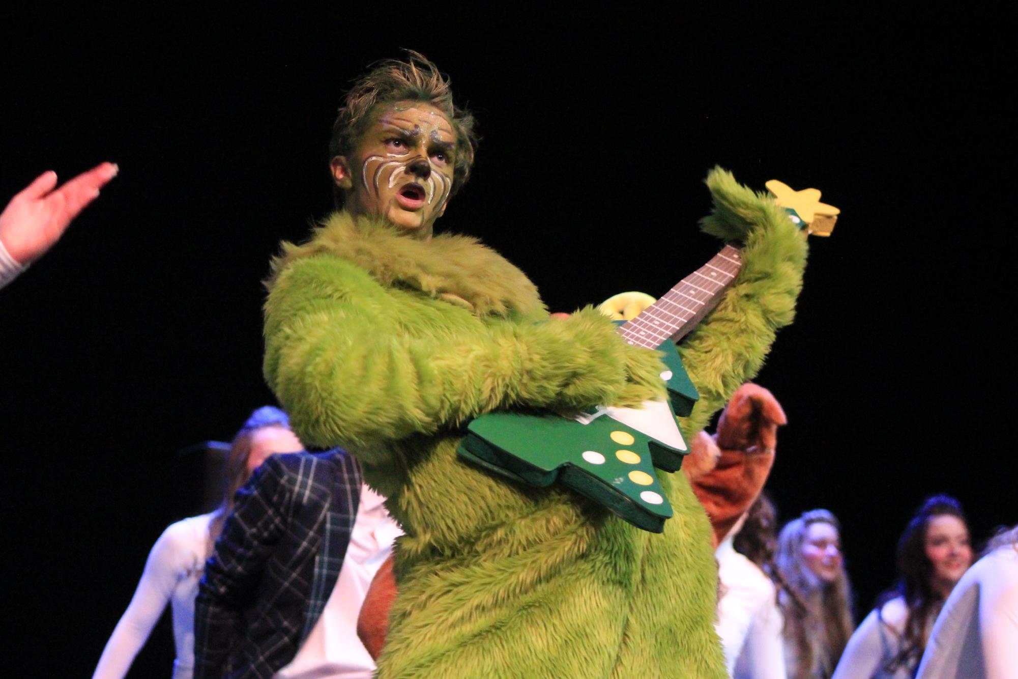 Senior Tyler Stover performs as the Grinch in Southwest's varsity show choir, Resonance. Southwest is hosting their annual show choir Showdown invitational on Saturday, Feb. 8, 2025.