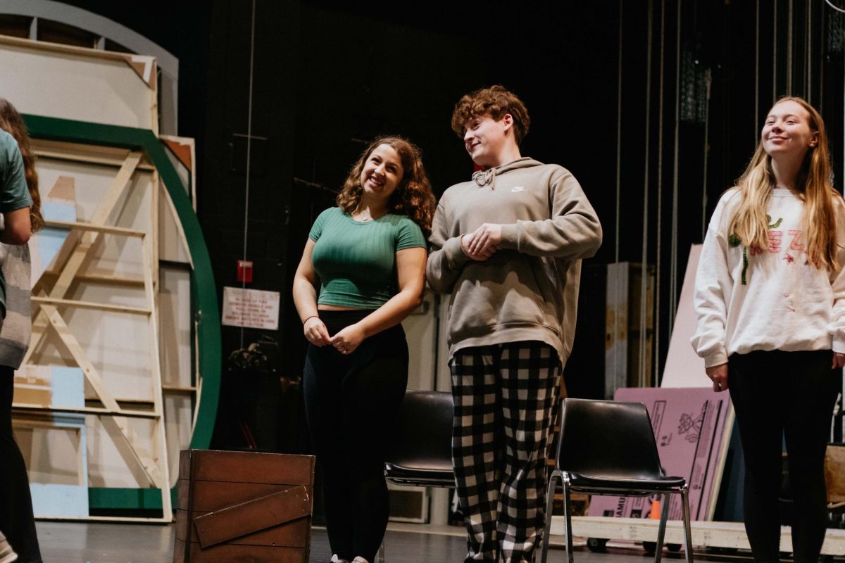 Sophomore Estes Stratman and junior Grant Johnson rehearse for "A Christmas Carol." These students along with 12 more are being initiated into the International Thespian Society on Wednesday.