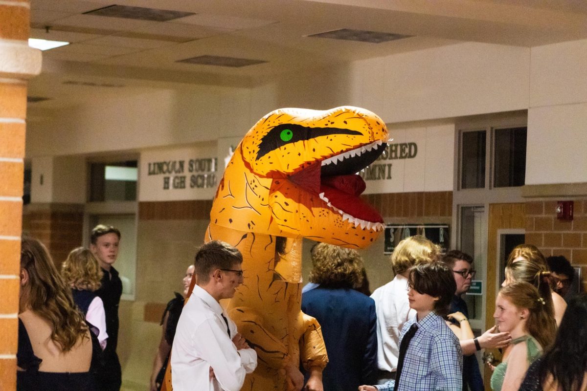 A student disguised as a dinosaur walks around the 2024 Homecoming event at LSW. In the 2025-2026 school year. Homecoming week is Sept. 29 to Oct. 3.