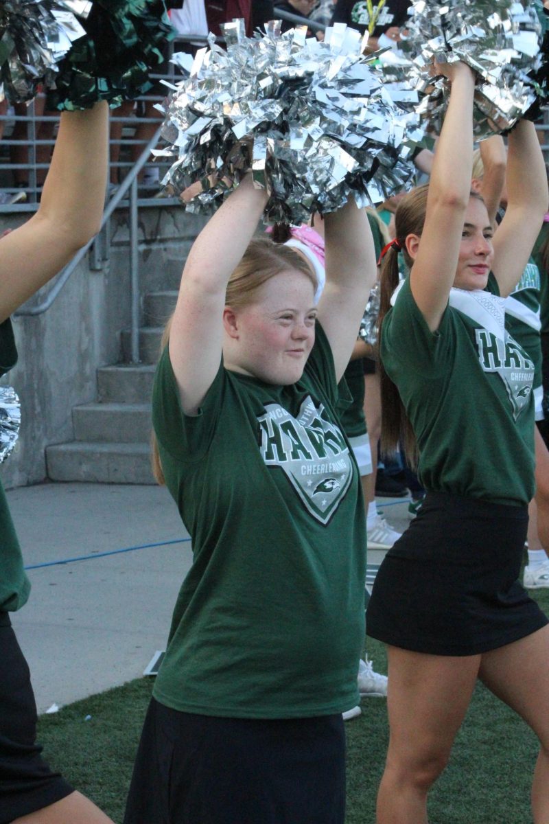 Senior Claire Bruns cheering for the Southwest crowd at a football game. Bruns joined Unified Cheer her freshman year, when it began.